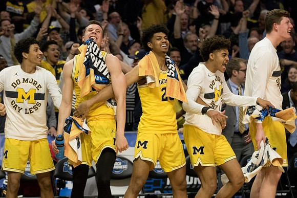 Eli Brooks (55), Duncan Robinson (22), Ibi Watson (23), Jordan Poole (2), and Jon Teske (15)