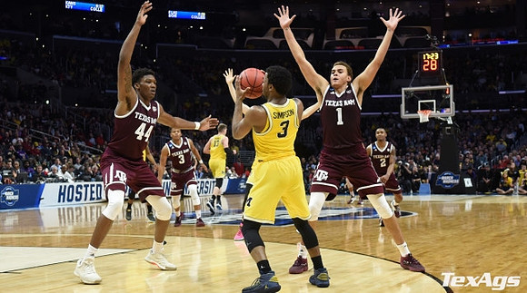 Zavier Simpson (3) and Moritz Wagner (13)