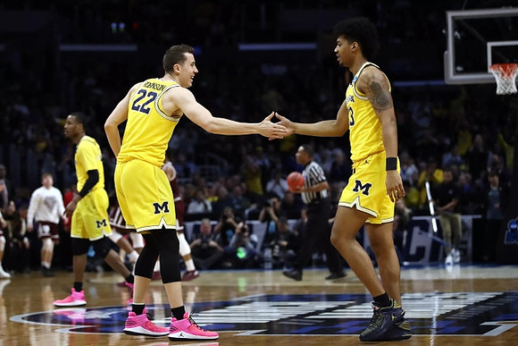 Muhammad-Ali Abdur-Rahkman (12), Duncan Robinson (22), and Ibi Watson (23)