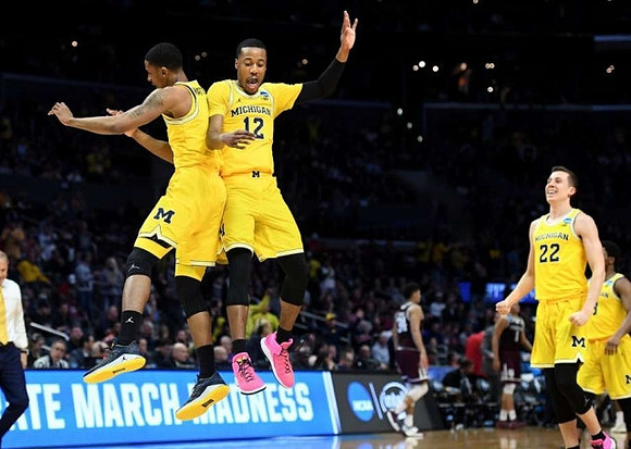 Charles Matthews (1), Muhammad-Ali Abdur-Rahkman (12), Duncan Robinson (22), and Zavier Simpson (3)