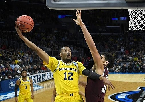 Zavier Simpson (3) and Muhammad-Ali Abdur-Rahkman (12)