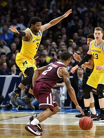 Zavier Simpson (3) and Moritz Wagner (13)