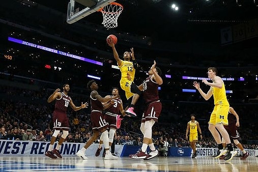 Muhammad-Ali Abdur-Rahkman (12), Ibi Watson (23), and Jon Teske (15)