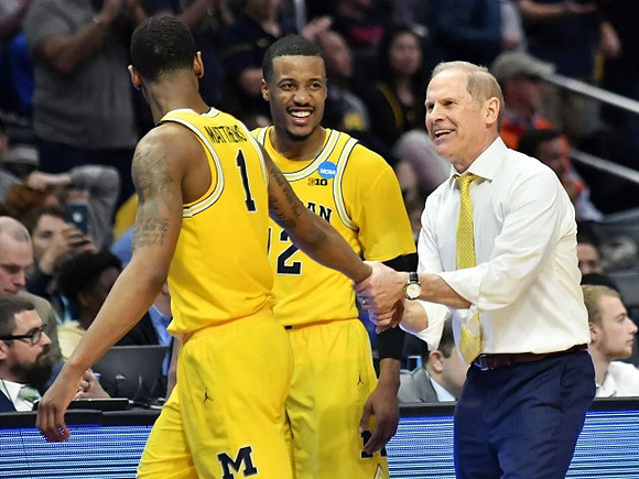 Charles Matthews (1), Muhammad-Ali Abdur-Rahkman (12), and John Beilein