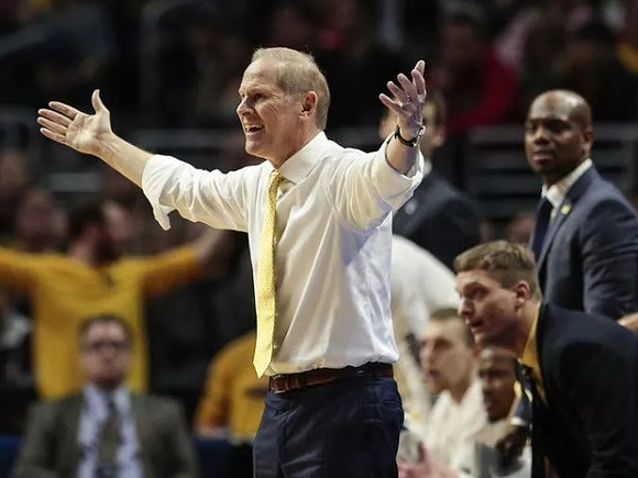 John Beilein, Luke Yaklich, and Deandre Haynes