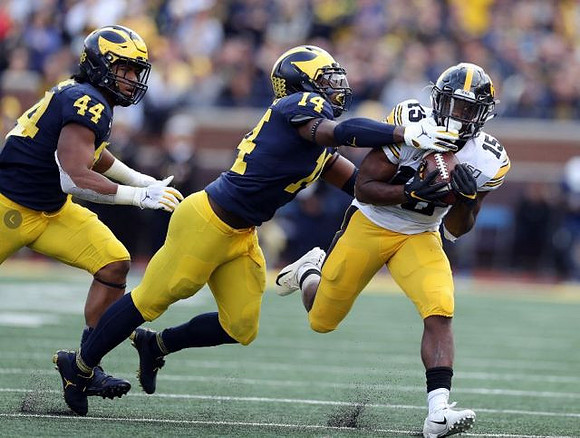 Cameron McGrone (44) and Josh Metellus (14)