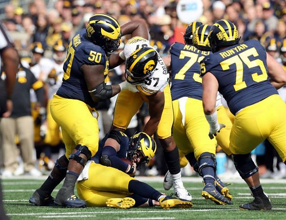 Michael Onwenu (50), Shea Patterson (2), Jalen Mayfield (73), and Jon Runyan Jr. (75)