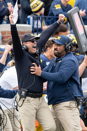 Jim Harbaugh and Shaun Nua