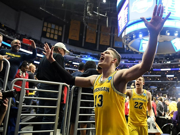 Moritz Wagner (13) and Duncan Robinson (22)
