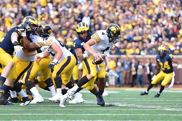 Aidan Hutchinson (97), Cameron McGrone (44), and Lavert Hill (24)