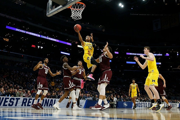 Muhammad-Ali Abdur-Rahkman (12), Ibi Watson (23), and Jon Teske (15)