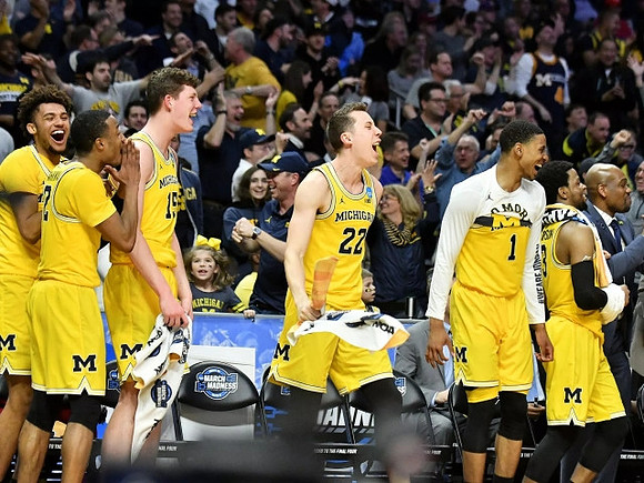 Isaiah Livers (4), Muhammad-Ali Abdur-Rahkman (12), Jon Teske (15), Duncan Robinson (22), Charles Matthews (1), and Zavier Simpson (3)