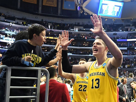 Moritz Wagner (13) and Duncan Robinson (22)