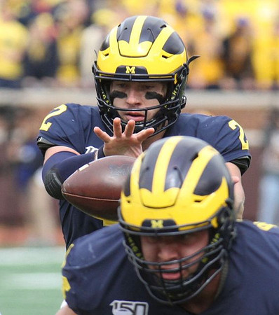 Shea Patterson (2) and Ben Bredeson (74)