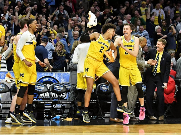 Charles Matthews (1), Jordan Poole (2), Duncan Robinson (22), Saddi Washington, and Luke Yaklich