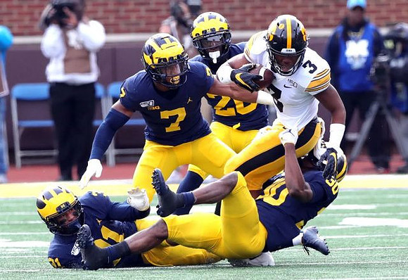 Vincent Gray (31), Khaleke Hudson (7), Daxton Hill (30), and Brad Hawkins (20)