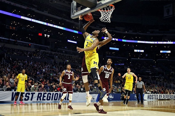 Muhammad-Ali Abdur-Rahkman (12), Zavier Simpson (3), and Moritz Wagner (13)
