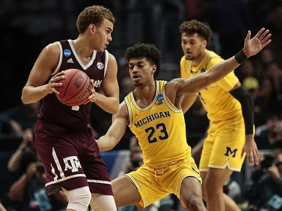 Ibi Watson (23) and Isaiah Livers (4)