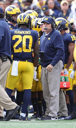 Brad Hawkins (20) and Don Brown