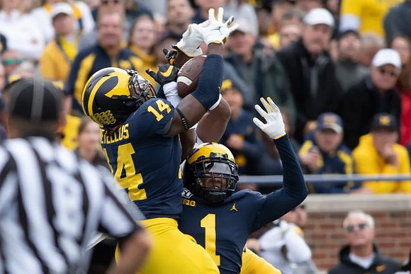 Josh Metellus (14) and Ambry Thomas (1)