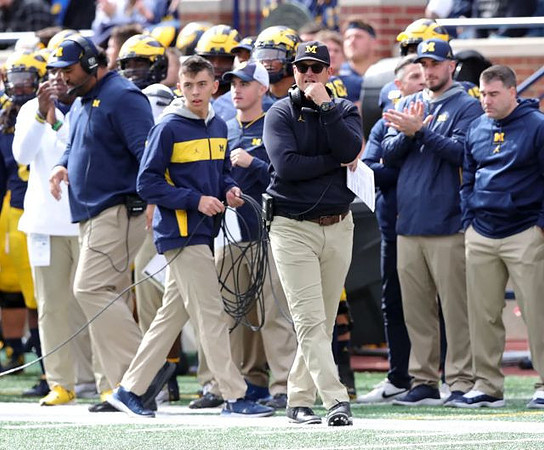 Jim Harbaugh and Shaun Nua