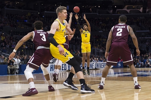 Moritz Wagner (13) and Jordan Poole (2)