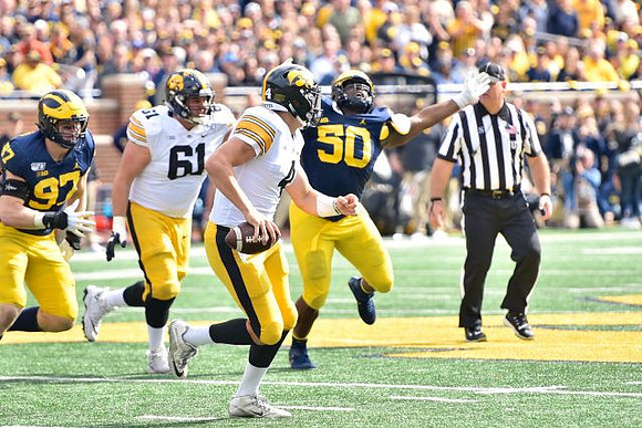 Aidan Hutchinson (97) and Michael Dwumfour (50)