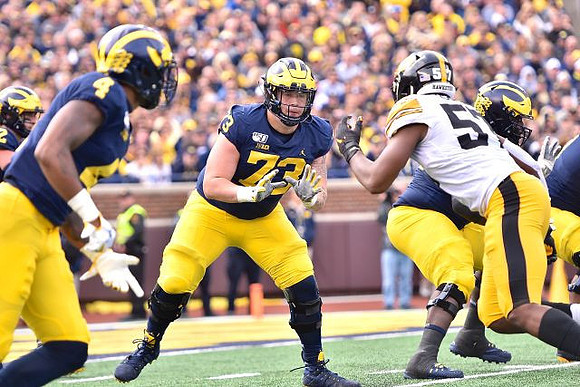 Shea Patterson (2), Nico Collins (4), and Jalen Mayfield (73)