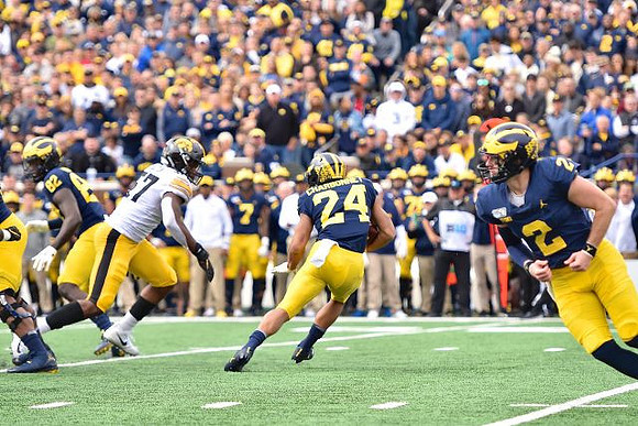Nick Eubanks (82), Zach Charbonnet (24), and Shea Patterson (2)