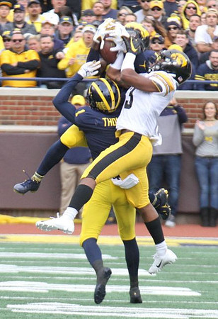 Ambry Thomas (1) and Josh Metellus (14)