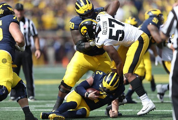 Jon Runyan Jr. (75), Shea Patterson (2), Michael Onwenu (50), and Cesar Ruiz (51)