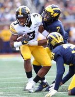 Khaleke Hudson (7) and Vincent Gray (31)