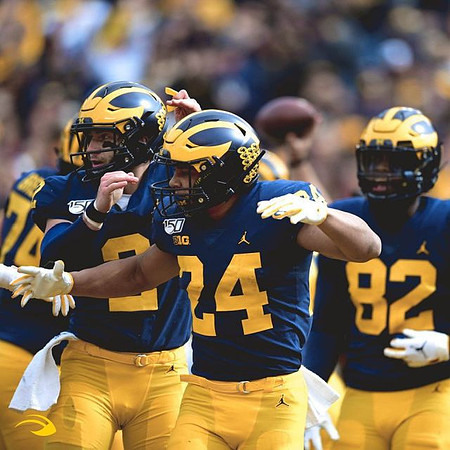 Ben Bredeson (74), Shea Patterson (2), Zach Charbonnet (24), and Nick Eubanks (82)