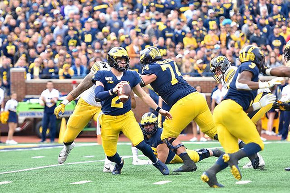 Shea Patterson (2), Ben Bredeson (74), Jon Runyan Jr. (75), and Christian Turner (3)