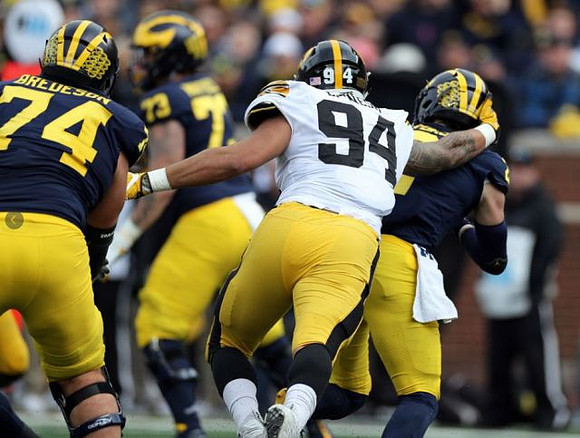 Ben Bredeson (74), Jalen Mayfield (73), and Shea Patterson (2)