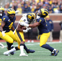 Michael Danna (4) and Khaleke Hudson (7)