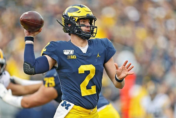 Jon Runyan Jr. (75) and Shea Patterson (2)