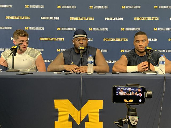 Shea Patterson (2), Kwity Paye (19), and Khaleke Hudson (7)