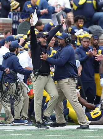 Jim Harbaugh and Shaun Nua