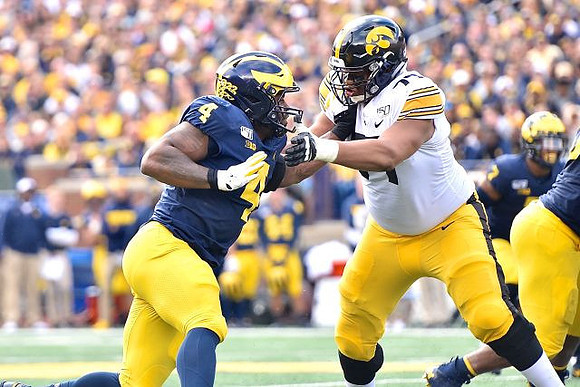 Michael Danna (4) and Khaleke Hudson (7)
