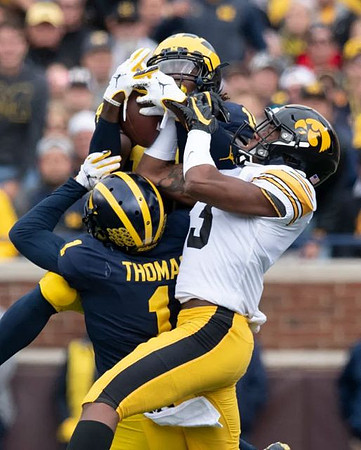 Josh Metellus (14) and Ambry Thomas (1)