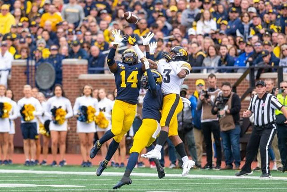 Josh Metellus (14) and Ambry Thomas (1)