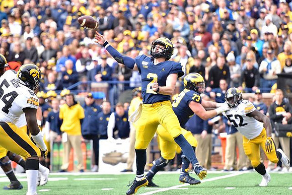 Shea Patterson (2) and Jalen Mayfield (73)