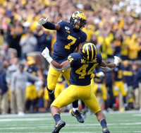 Khaleke Hudson (7) and Cameron McGrone (44)