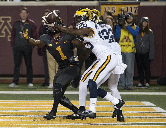 Jourdan Lewis (26) and Jarrod Wilson (22)