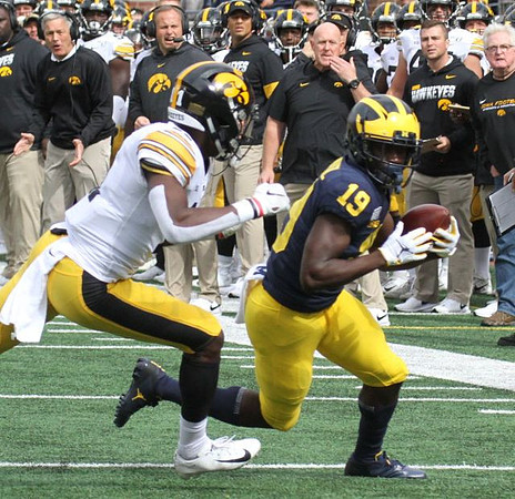 Iowa Head Coach Kirk Ferentz and Mike Sainristil (19)