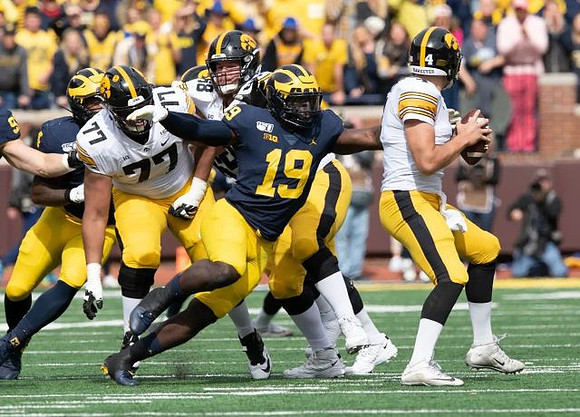 Aidan Hutchinson (97), Michael Danna (4), and Kwity Paye (19)