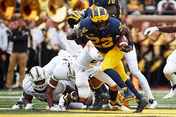 Juwann Bushell-Beatty (76) and Karan Higdon (22)