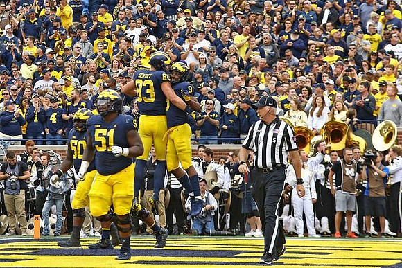 Cesar Ruiz (51), Michael Onwenu (50), Zach Gentry (83), and Donovan Peoples-Jones (9)