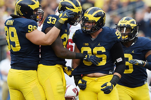 Matthew Godin (99), Taco Charlton (33), Ryan Glasgow (96), and Mike McCray (9)